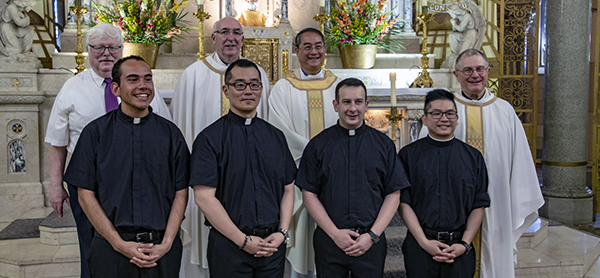 Front row (l to r): Newly professed Divine Word Missionaries Christian Castro, John Cho, Martin Herrera and Hoang Minh Tran. Back row (l to r): Brother Mat Zemel SVD, assistant novice director; Father Michael Hutchins SVD, vice provincial; Father Quang Duc Dinh SVD, provincial; and Father Timothy Lenchak SVD, novice director. First_vows_2018_page_for_web